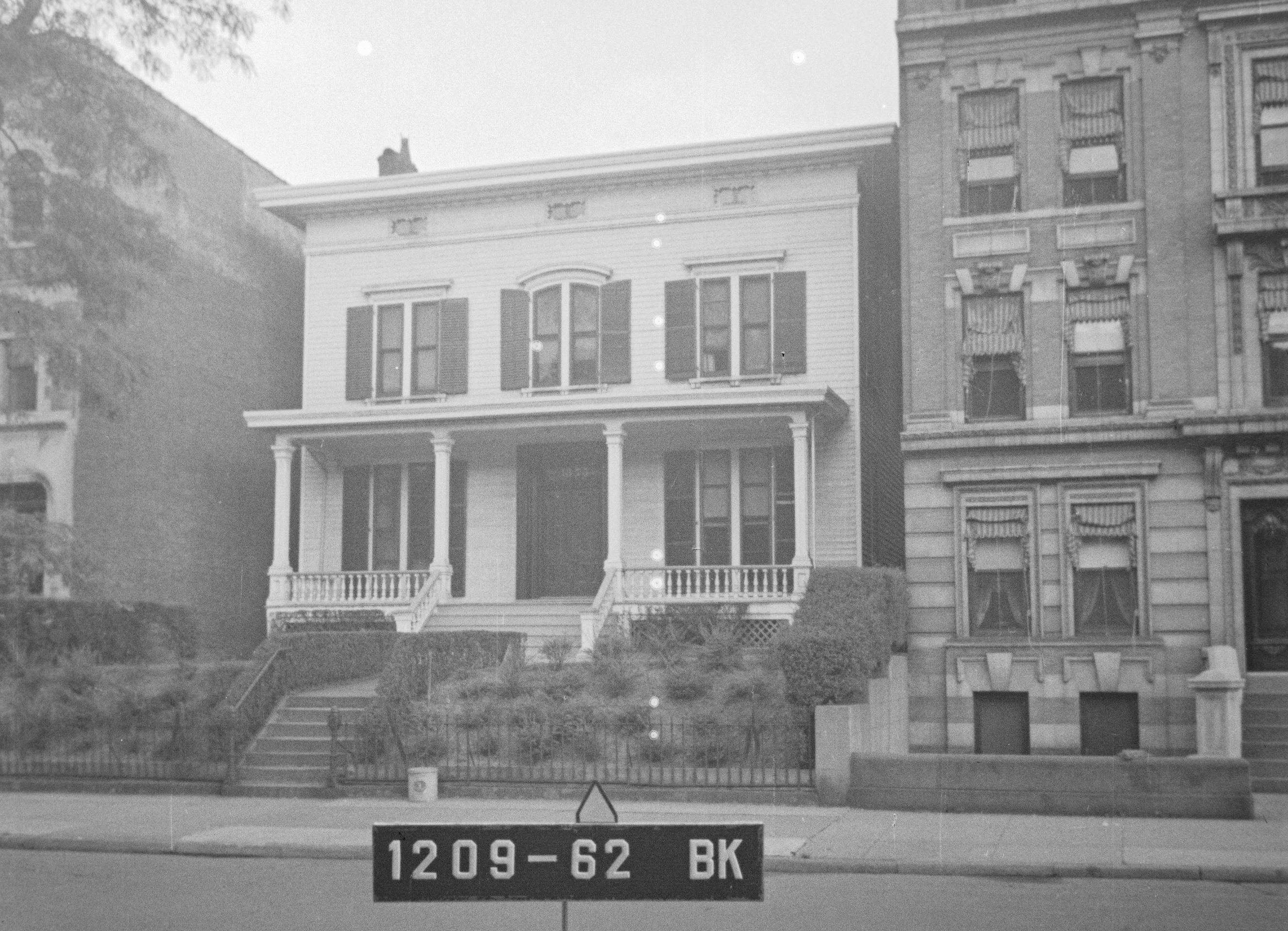black and white photo of wood frame house