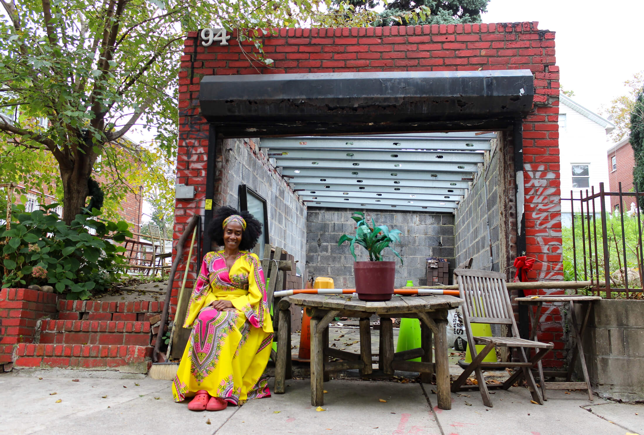 tami green in front of her garage