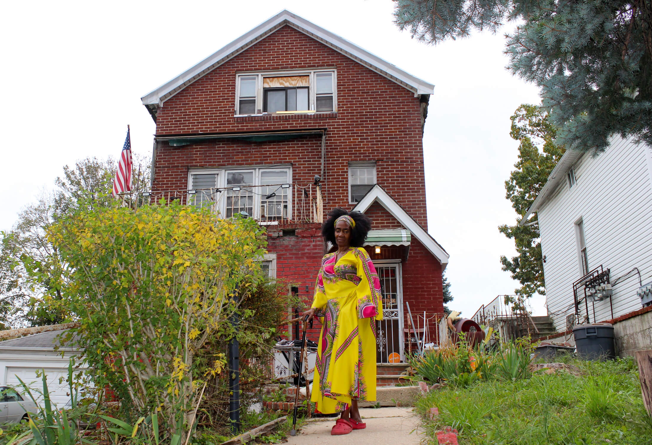 tami green in front of her house