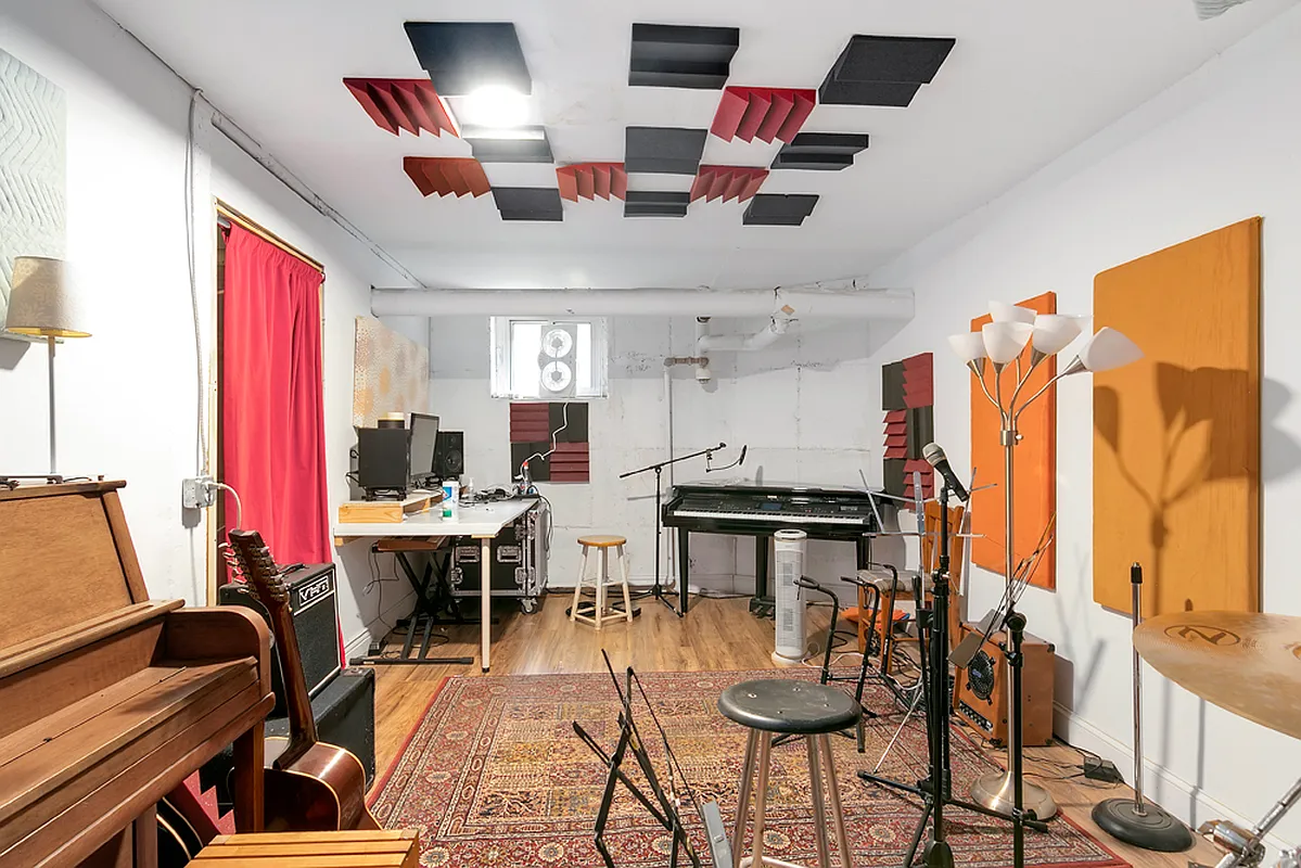 music room in basement with sound proofing and various instruments