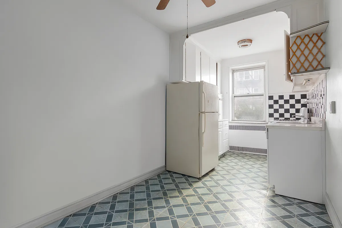 virtually edited kitchen with tile floor, white appliances and a ceiling fan in the dining nook