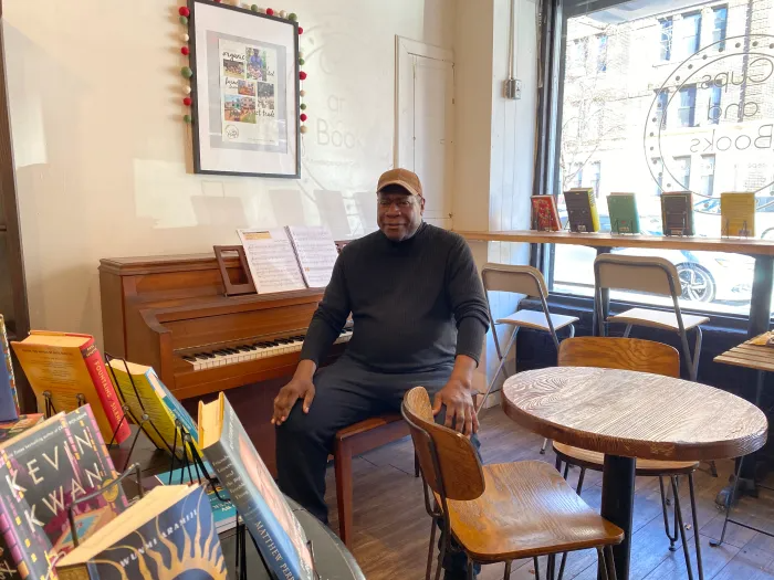 man seating in his cafe