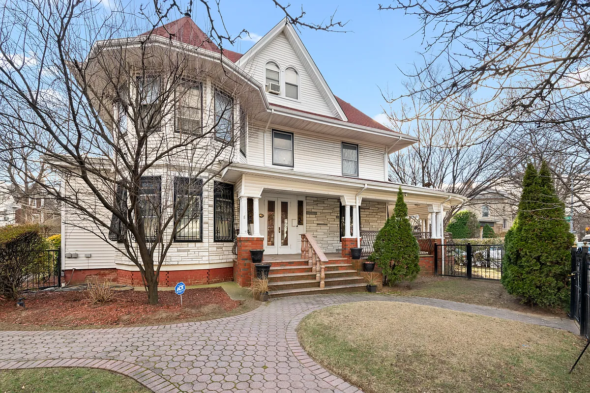 exterior showing first floor refaced with stone