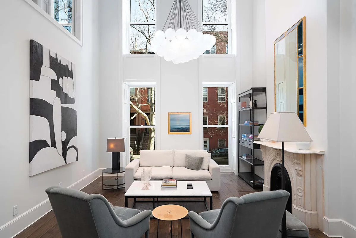 double height room with marble mantel