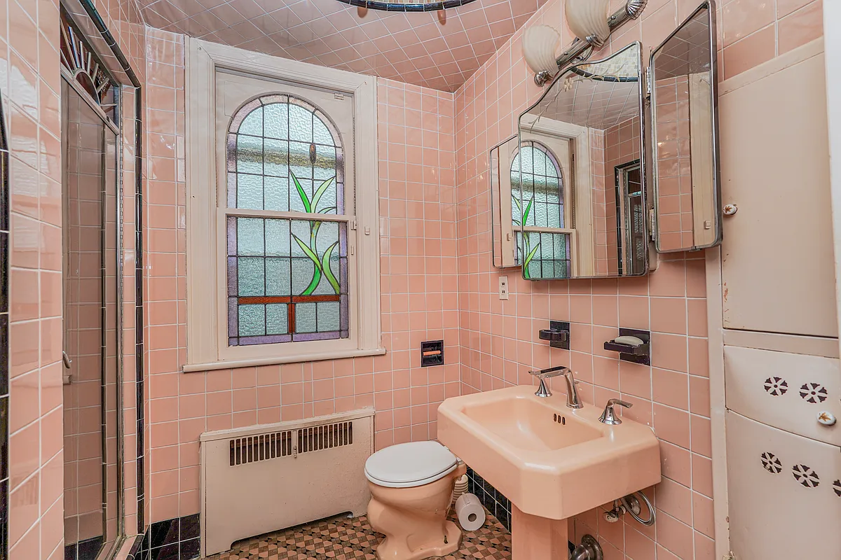 art deco bath with pink fixtures and tile