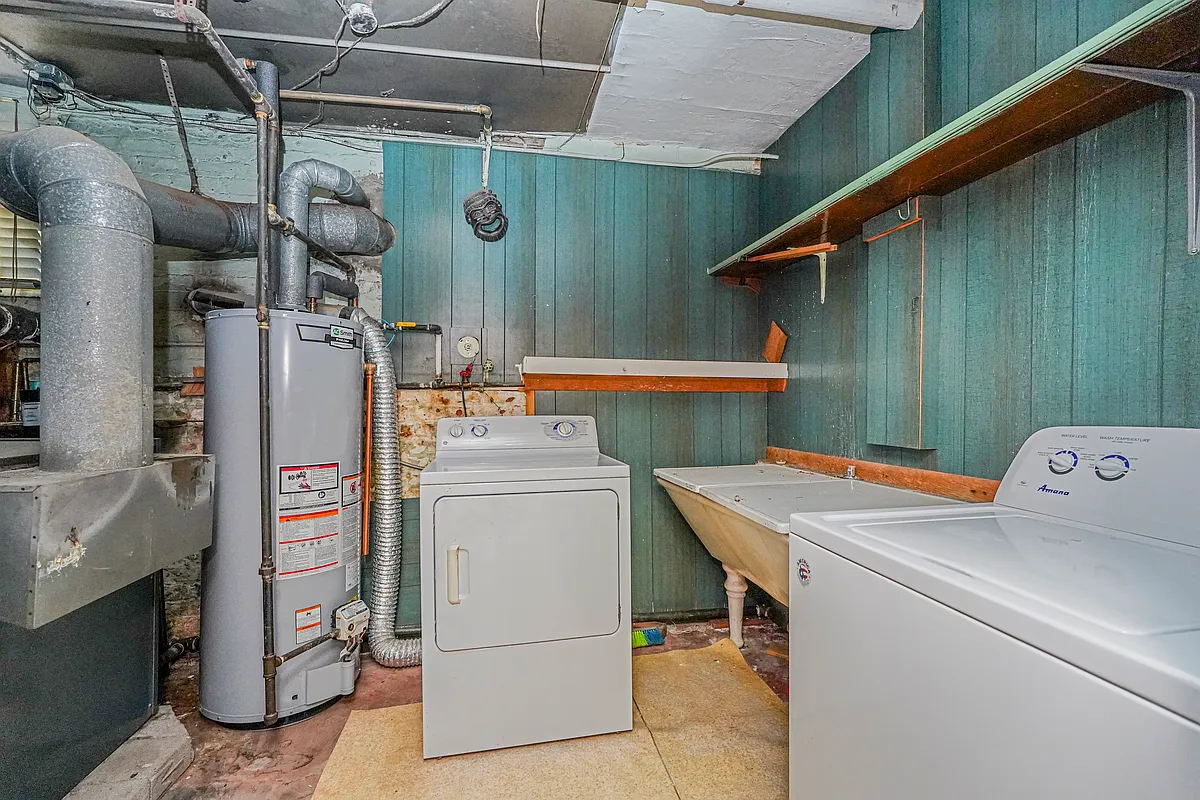 laundry room with modern appliances and original 1930s utility sink