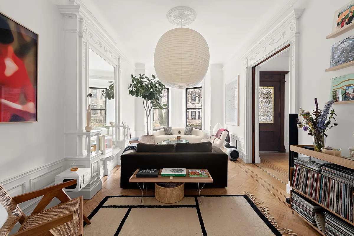 parlor with white walls, wood floor