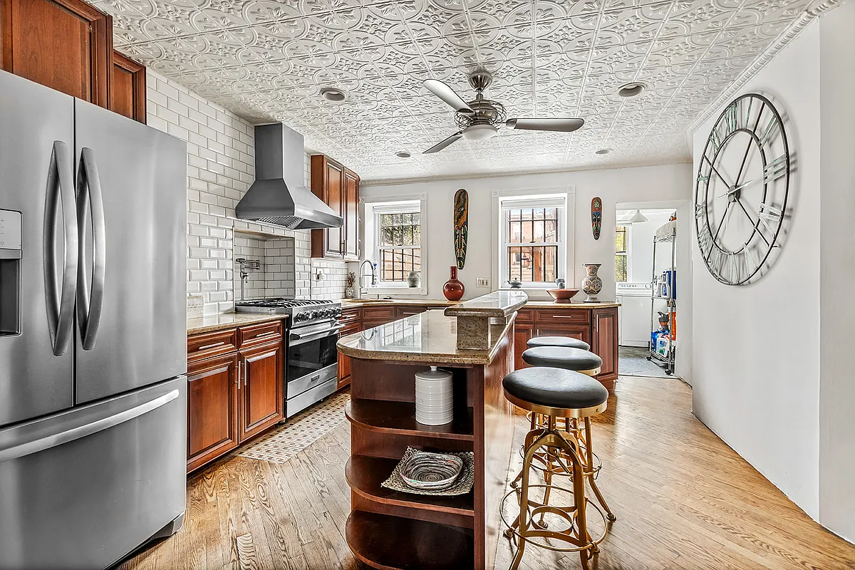 kitchen with tin ceiling, wood floor