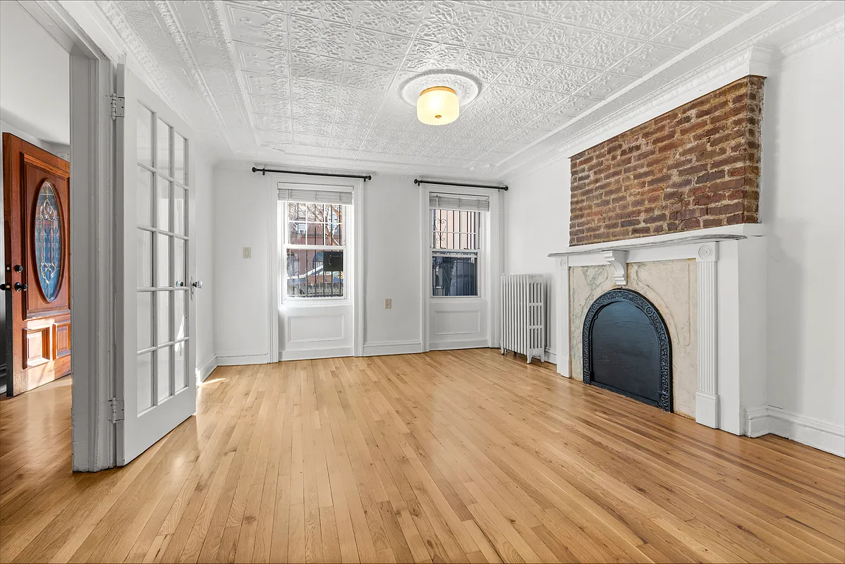 garden level with tin ceiling, wood floor, mantel