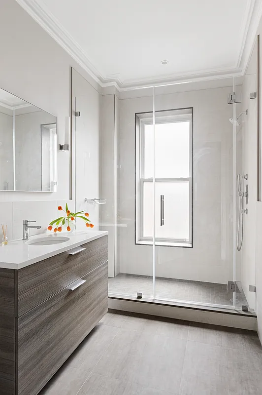 bathroom with glass doors to shower
