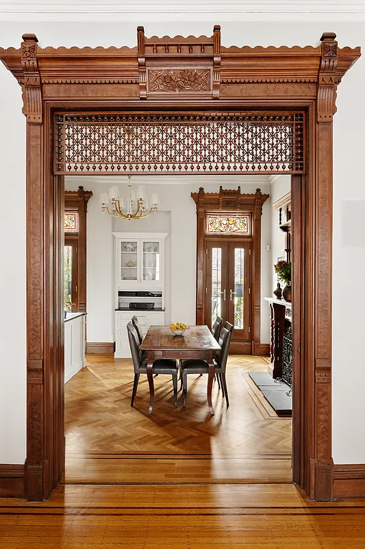 door way between parlor and kitchen with fretwork