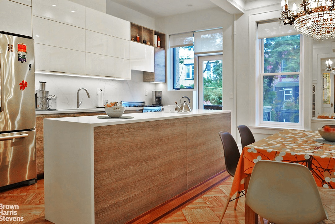 kitchen with island, white cabinets